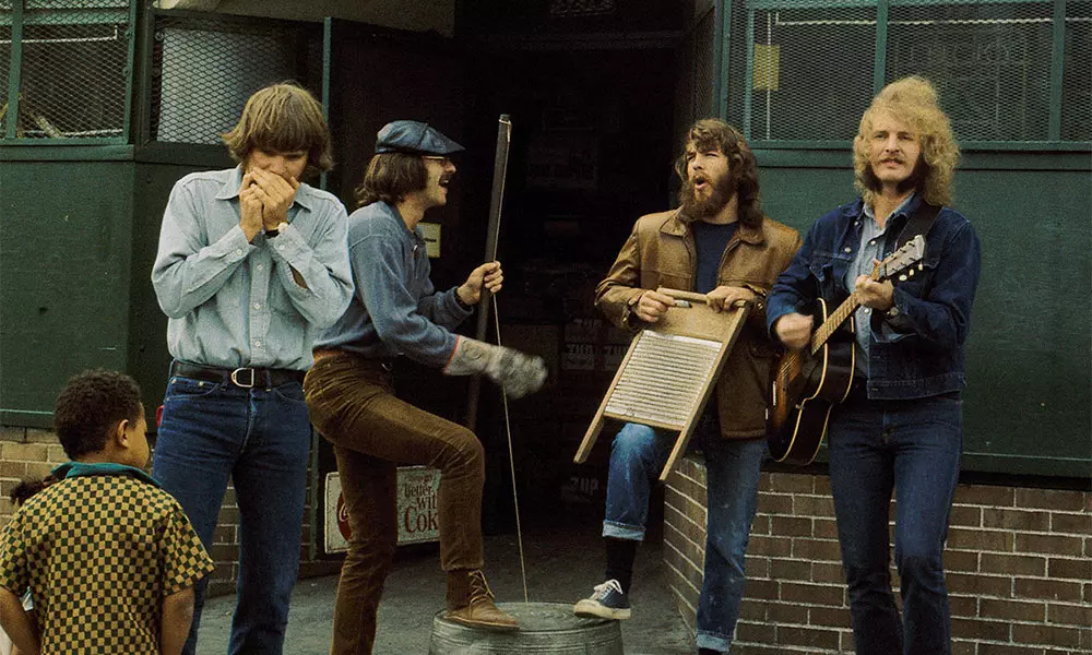 Creedence Clearwater Revival, doing what they do best, playing music. Photo shoot foe "Willy and the Poorboys".