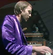 Alan Clark arrives as Dire Straits keyboard player.