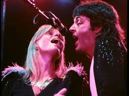 Paul McCartney and Linda McCartney harmonize during their 1976 world tour.