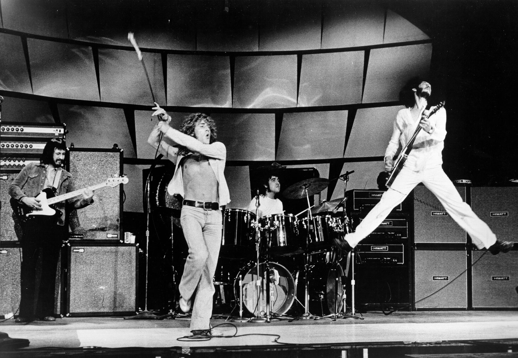 The Who in a typical action shot, Pete off the ground, Roger swinging Microphone, Keith flying around the kit, and John being John, just playing hi bass.