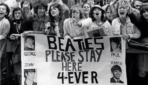 Fans greet the Beatles, the biggest influence on American Rock bands in history.